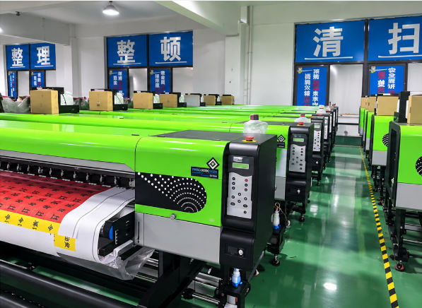 A row of wide-format roll-to-roll printing machines in a production hall