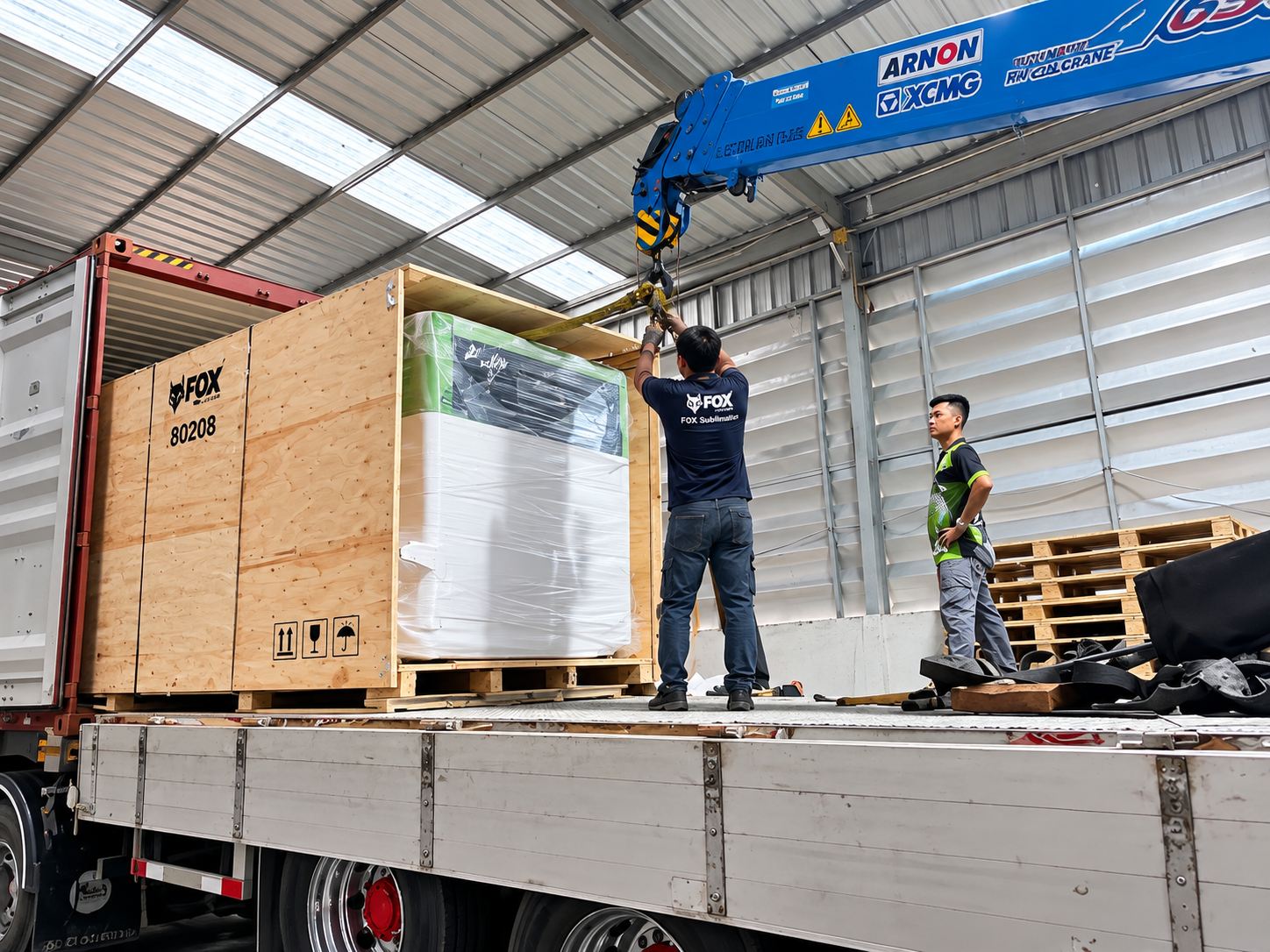 Roll-packed goods being loaded into a shipping container